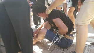 HK protesters insult car driver after blocking roads